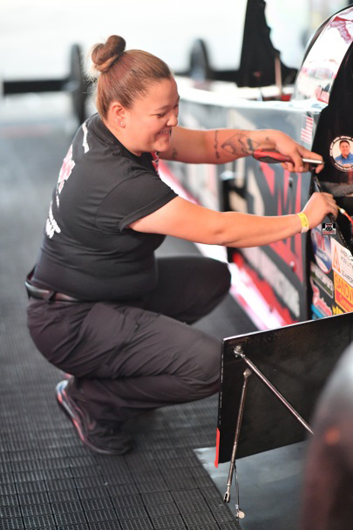 Eileen Dominguez working on a vehicle