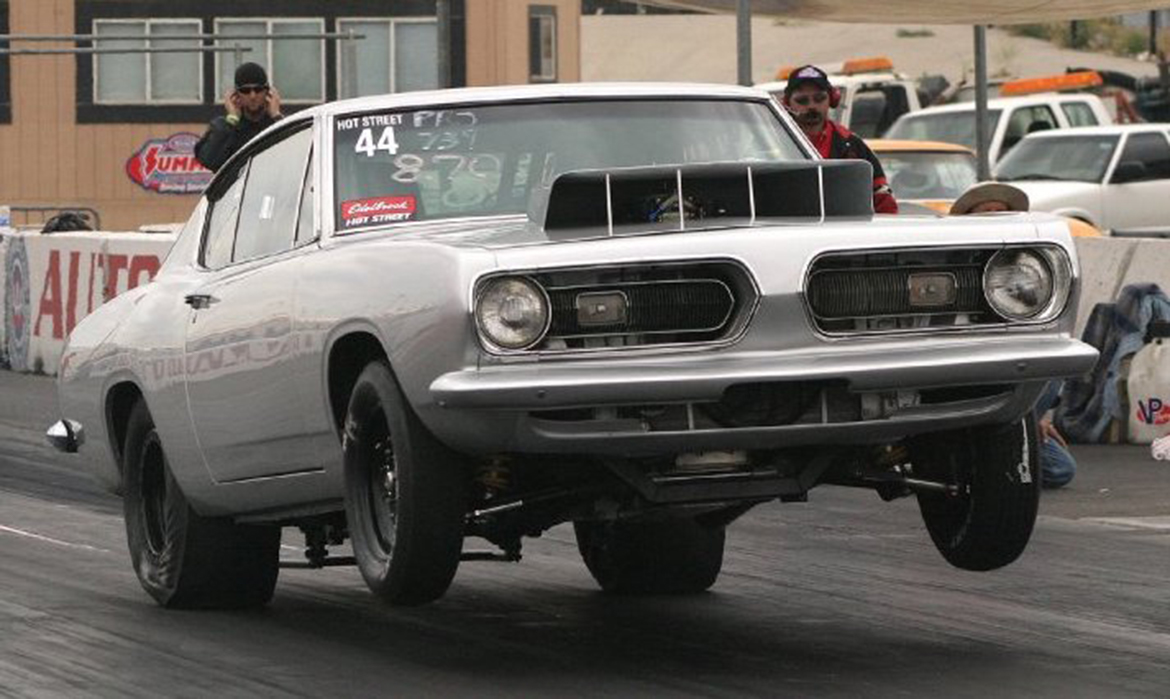 Vehicle on two wheels on a drag strip