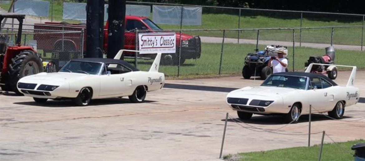 Two Plymouth Superbirds on the starting line of a drag strip