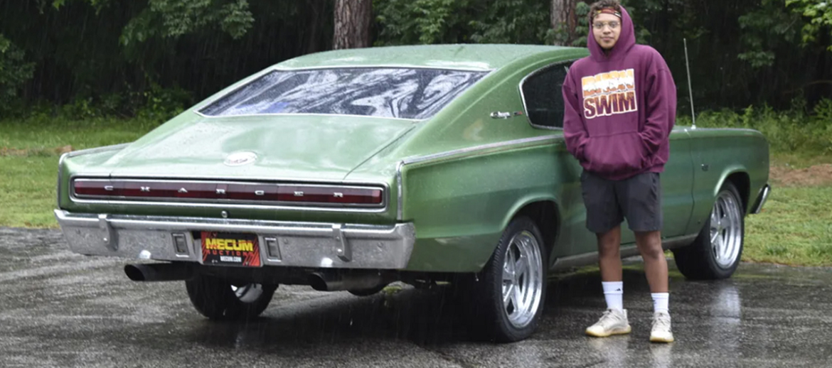 Teenager with a 1966 Dodge Charger