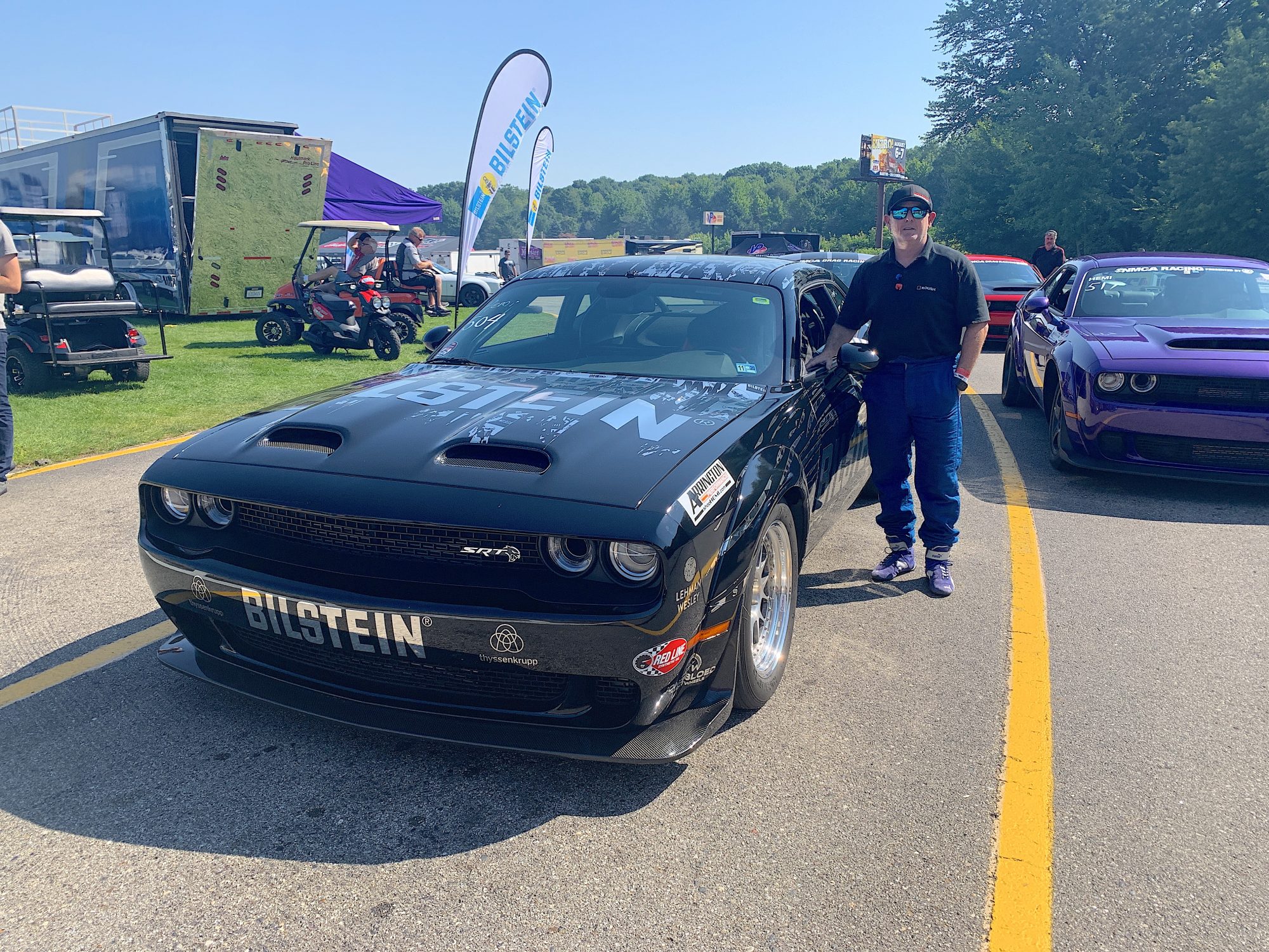 Man standing beside his Challenger