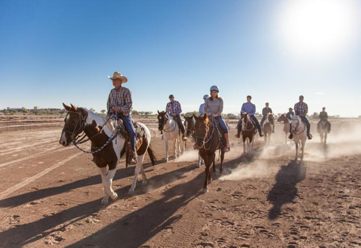 Group of people riding horses