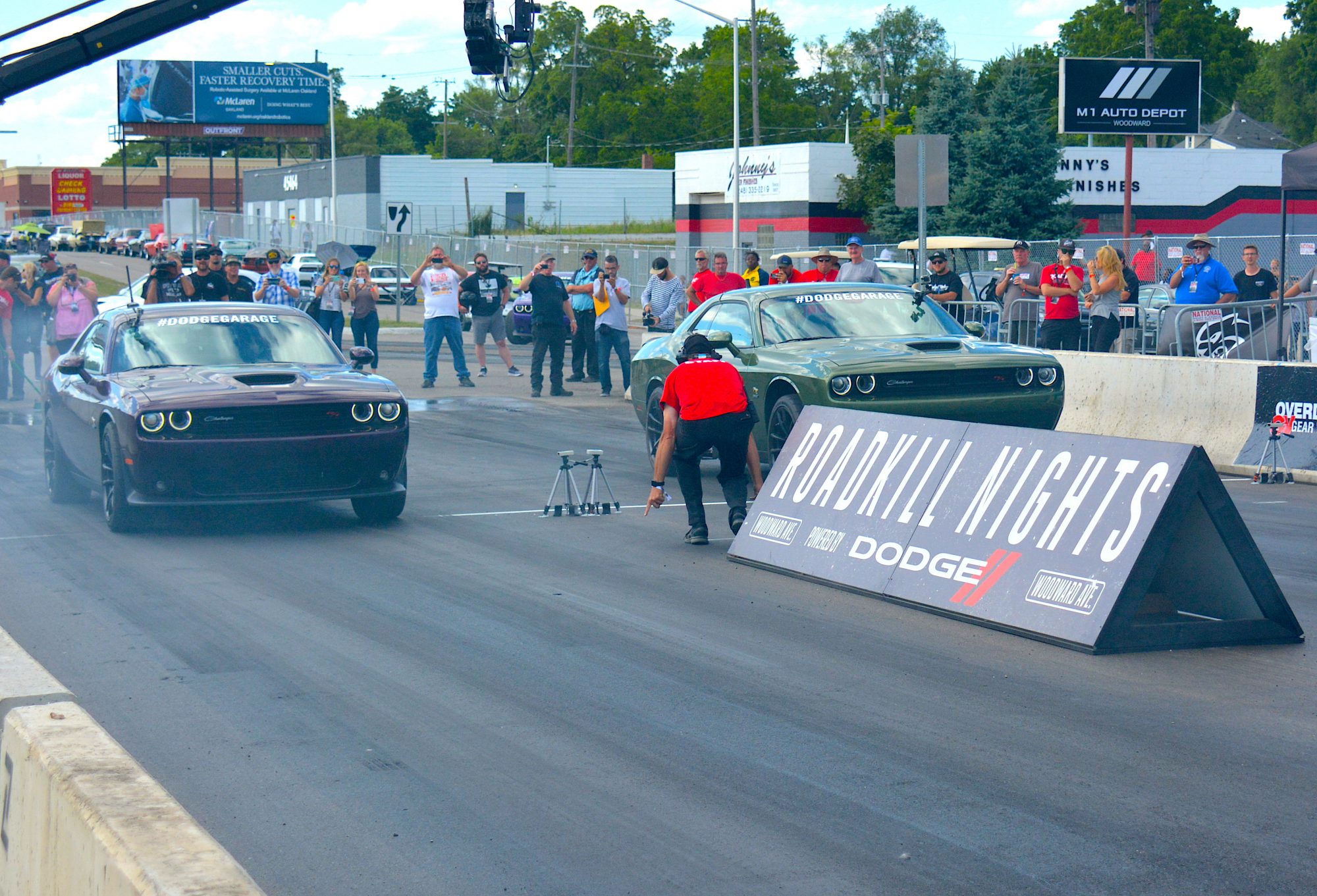 Two Challengers drag racing