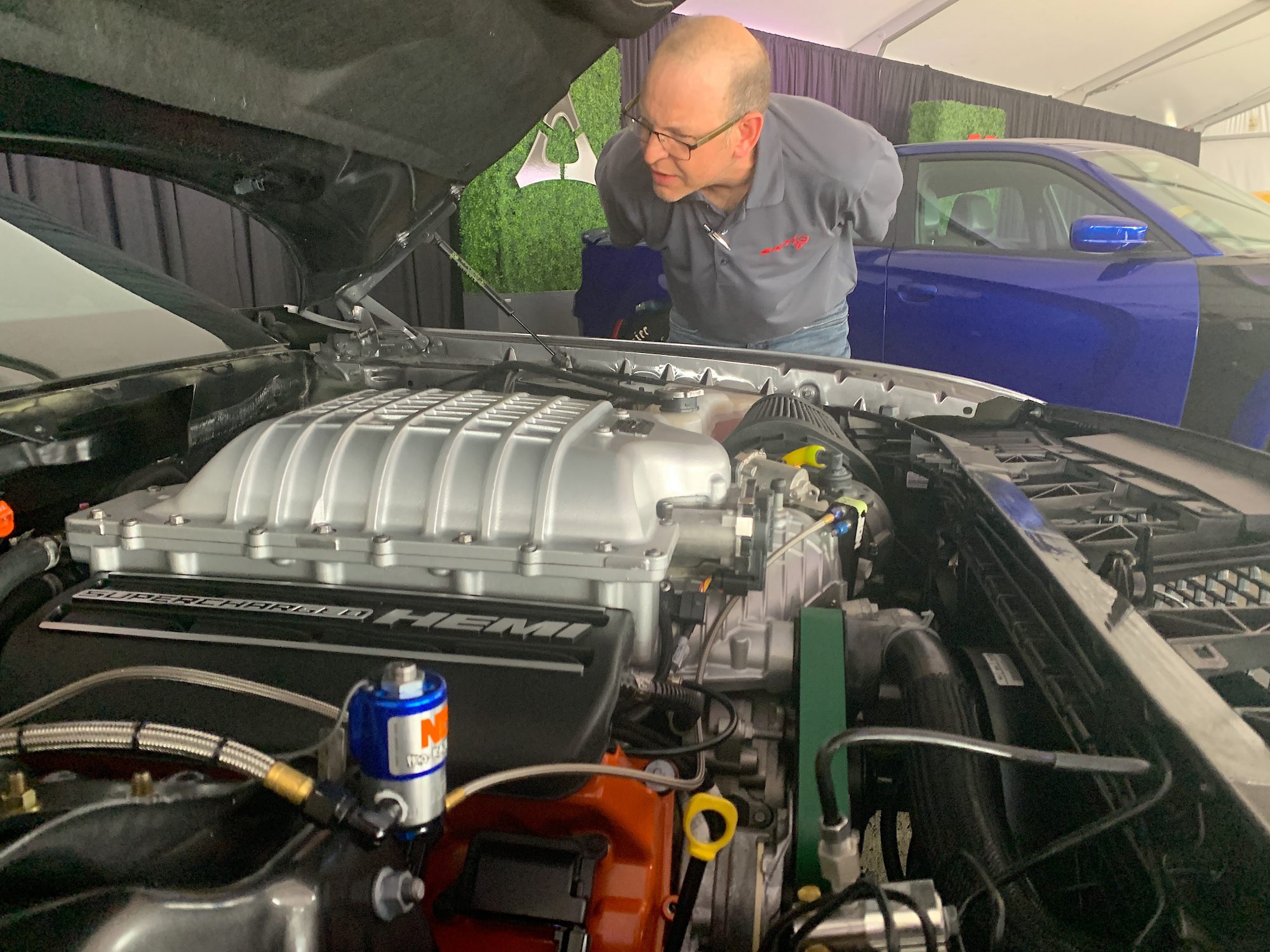 Man looking at a HEMI engine