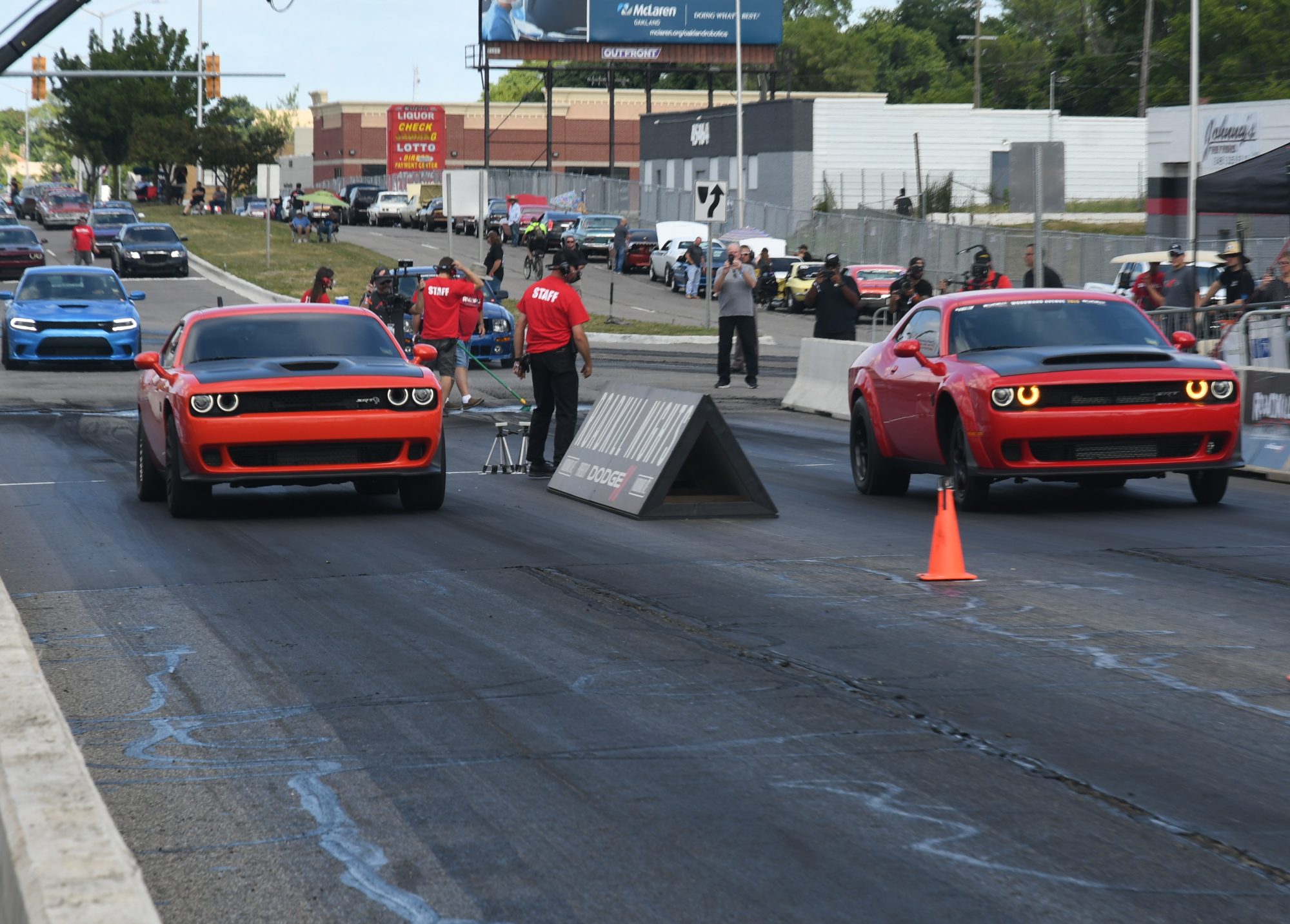 Two Challengers drag racing