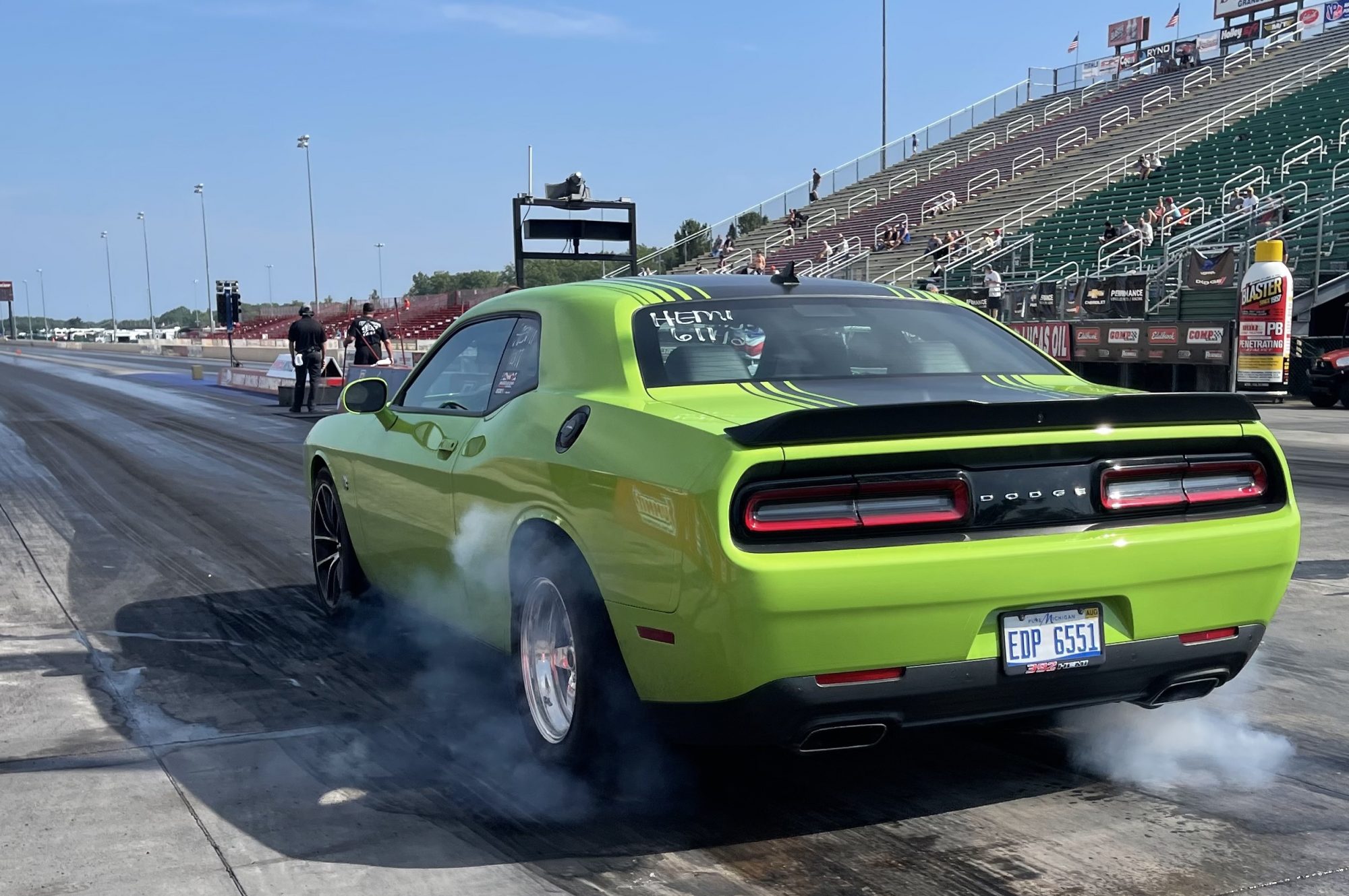 Challenger doing a burnout before drag racing