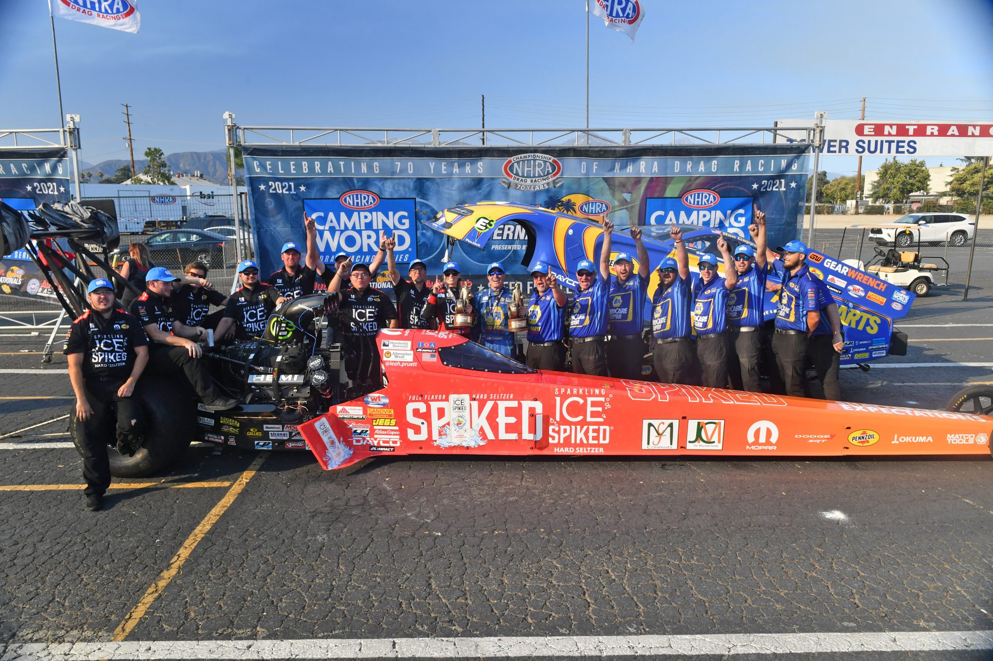 Leah Pruett & Ron Capps' teams posing after their win