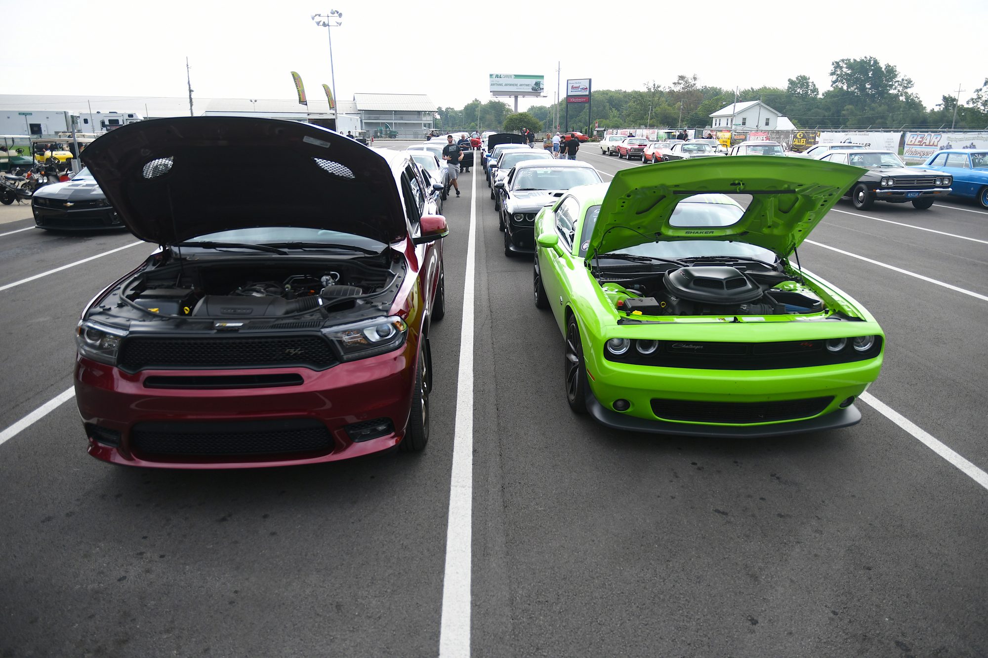 Dodge vehicles on display with their hoods open