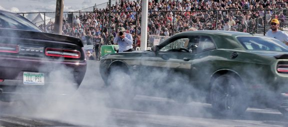 Vehicles on the starting line of a drag strip