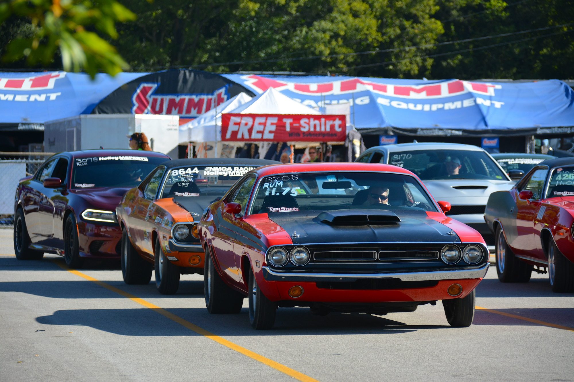 Row of Dodge vehicles getting ready to drag race