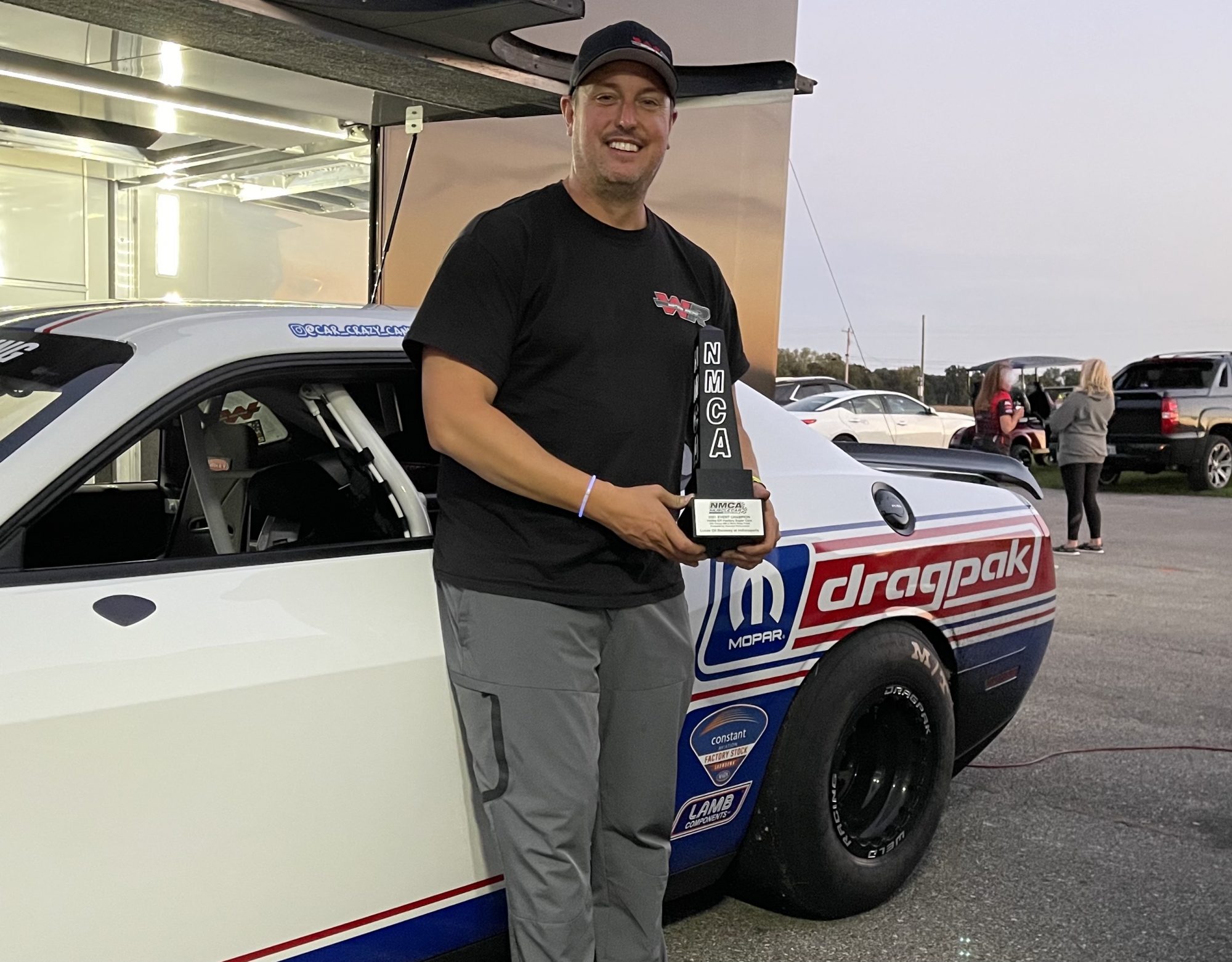 Dennis Chaisson holding his trophy from NMCA