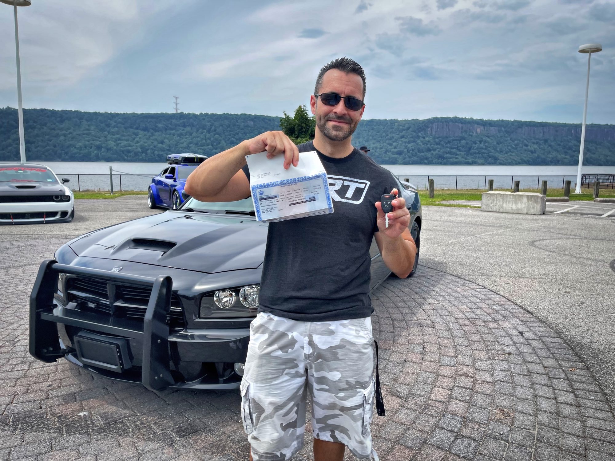 Man standing in front of Charger R/T