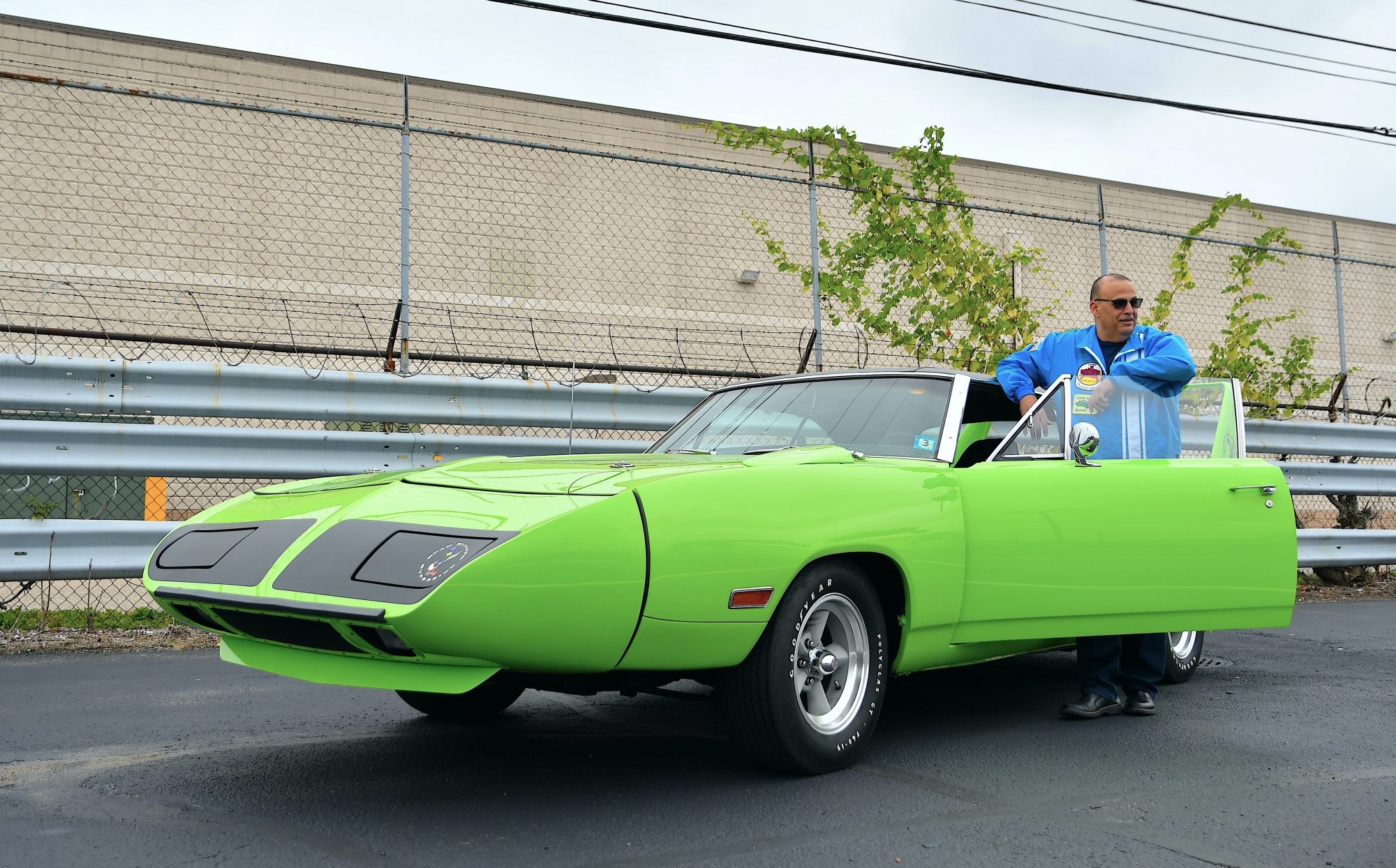 Man standing next to his Plymouth Road Runner
