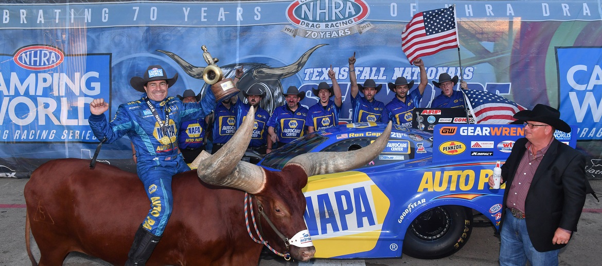 Ron Capps and hs team celebrating a win at NHRA FallNationals