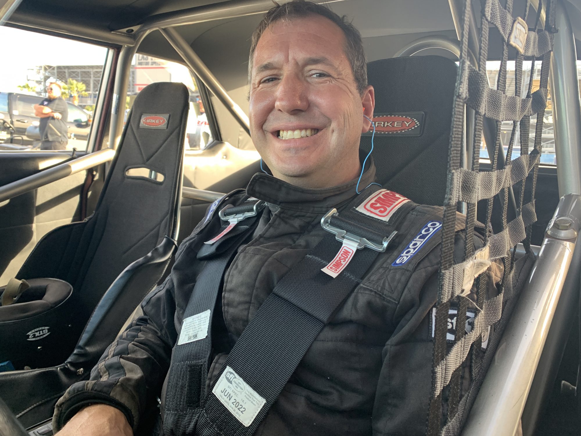 Man sitting inside race car