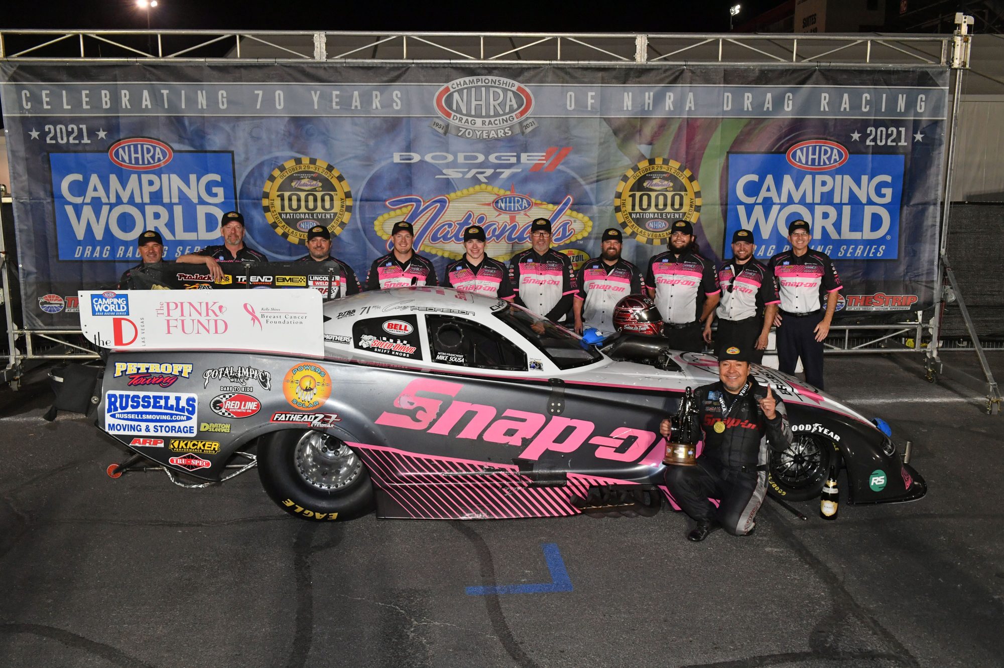 Cruz Pedregon and his team celebrating a win