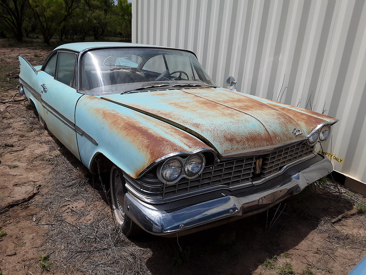 1962 Plymouth Belvedere four-door sedan finished in white with red interior