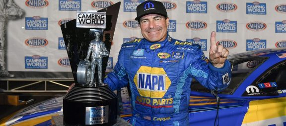 Ron Capps holding his championship wally trophy