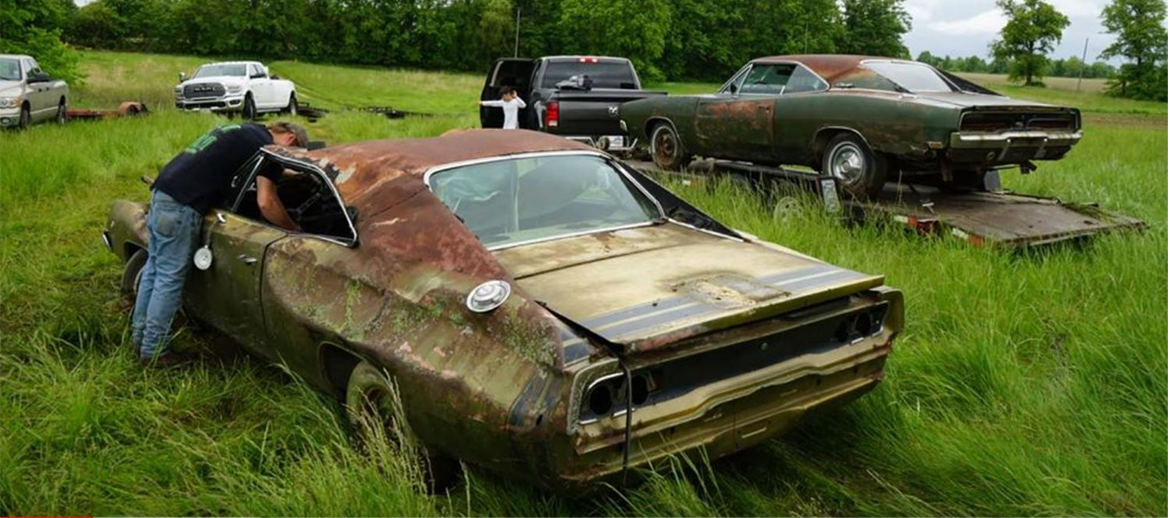 Decrepit Dodge Charger in a field