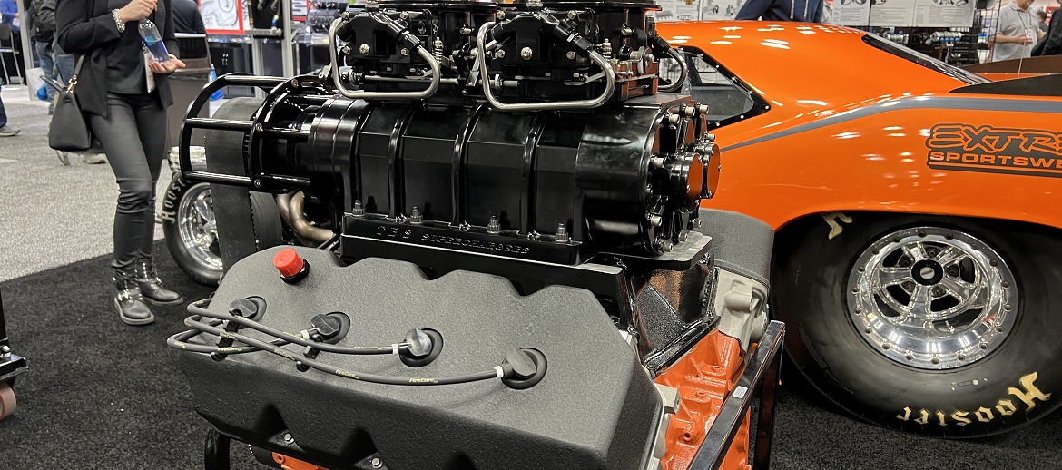 HEMI engine next to a vintage Dodge