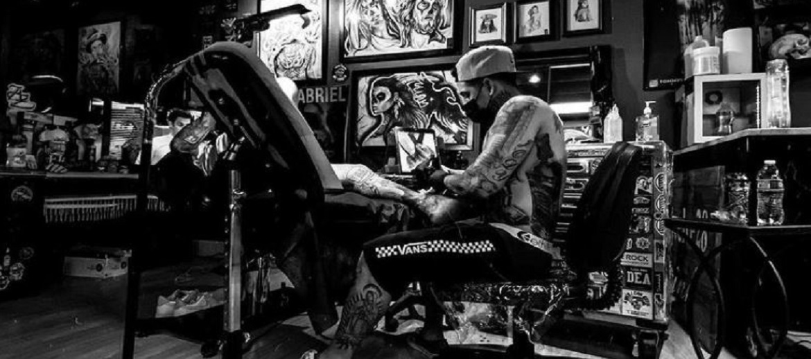 tattoo artist working