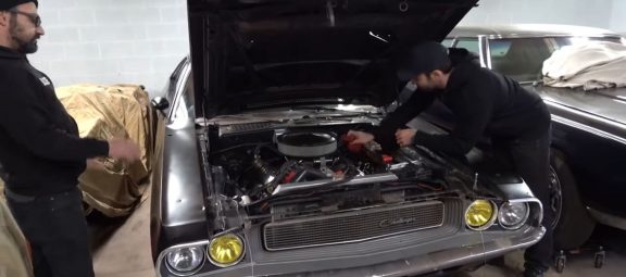 Two men working on a 1973 Challenger
