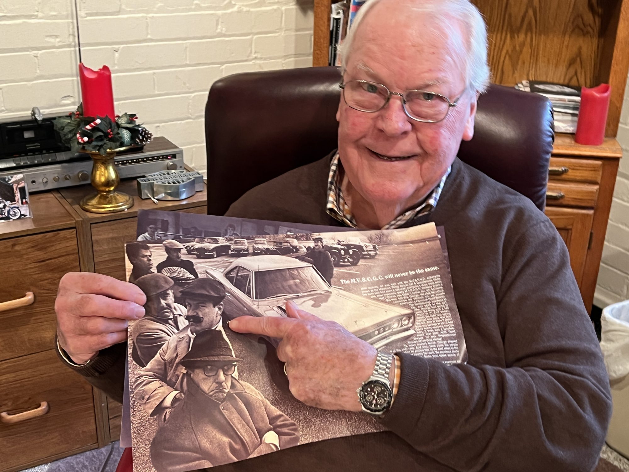 Man holding vintage advertisement