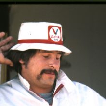 Man posing with a Valvoline hat on
