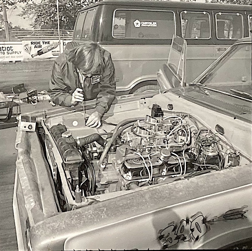 Man working on a race car