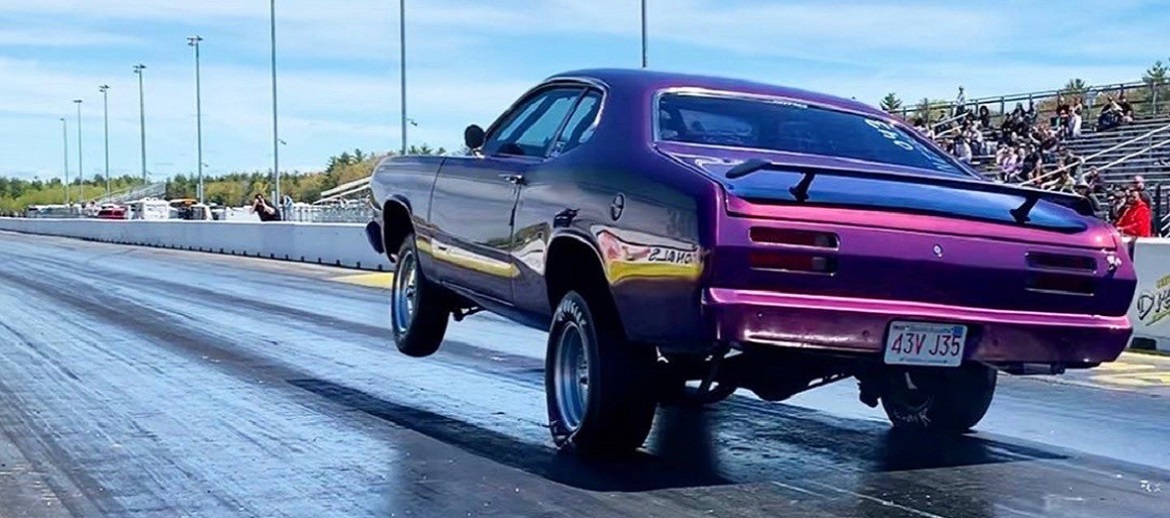 Vehicle on rear wheels on the drag strip