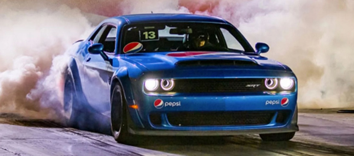 Blue Dodge Demon on the track at Radford Racing School