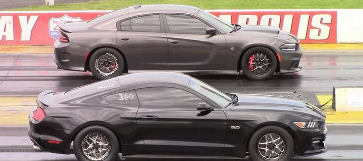 Dodge Charger racing a Ford Mustang at the Track
