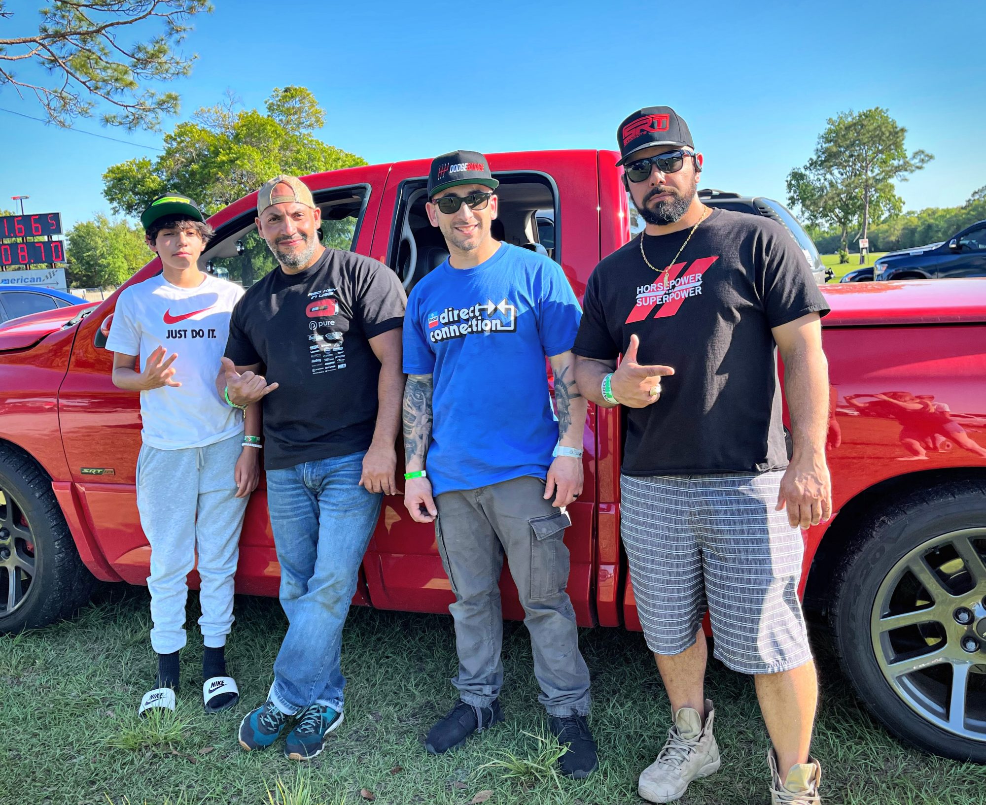 men posing with their truck