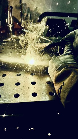 man welding