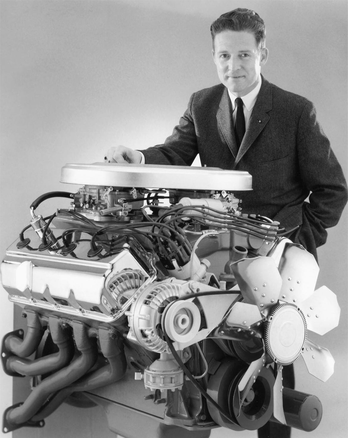 man standing with a HEMI engine