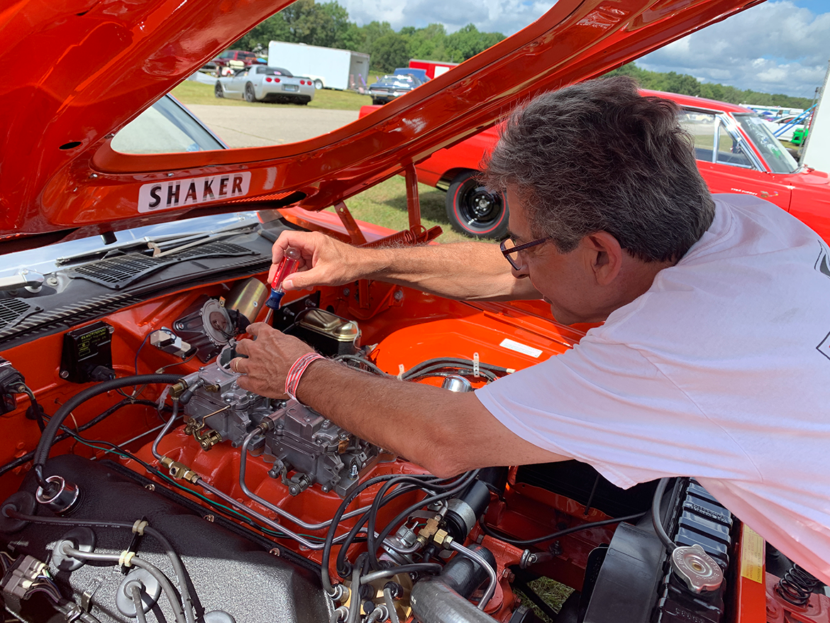 man working on a HEMI engine