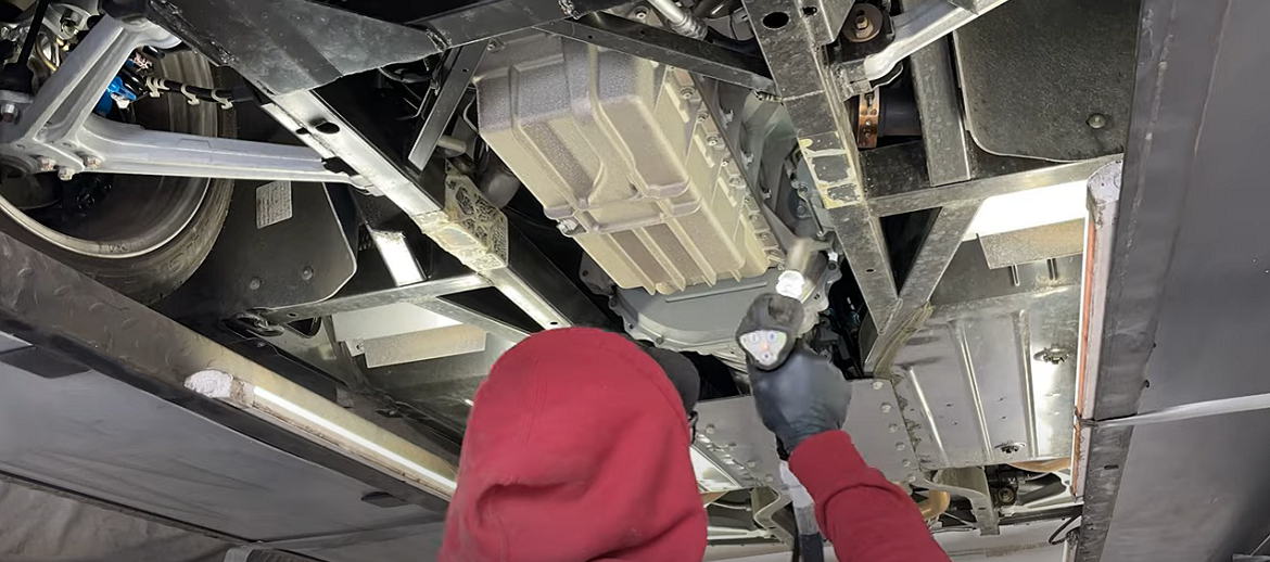 worker dry ice blasting a vehicle