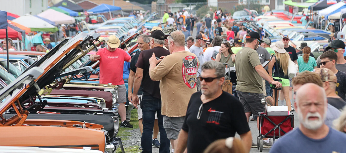 Chryslers of Carlisle event with lots of cars and people